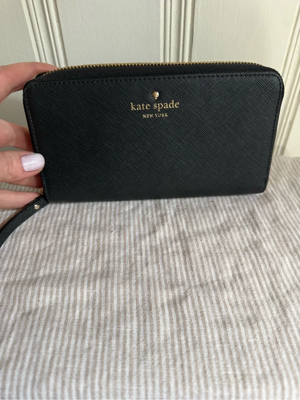 kate spade black zip-around wristlet wallet with gold logo